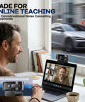 Next Gen 4K Webcam With Built In Mic For PC Streaming And Video Calls delivers footage as a man teaches online with dual mics.
