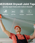 Worker using Fiberglass Mesh Drywall Tape For Quick Crack Repair Self Adhesive 1.97 Inch By 150 Foot Sheetrock Joint Tape.