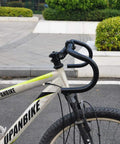 Close-up of fixed gear road bike with bent drop handlebars aluminum alloy 25.4mm or 31.8mm clamp black lightweight street bar.