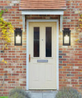Two Pack Outdoor Wall Lanterns Black Sconce Lights With Clear Glass Shade Waterproof Wall Mount E26 Socket Modern Anti Rust Porch Lighting Bulb Not Included mounted on brick wall beside door