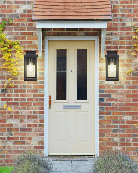 Two Pack Outdoor Wall Lanterns Black Sconce Lights With Clear Glass Shade Waterproof Wall Mount E26 Socket Modern Anti Rust Porch Lighting Bulb Not Included mounted on brick wall beside door
