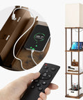 Brown Shelf Floor Lamp With 2 USB Ports And Power Outlet, Remote Control LED Bulb, displaying phone charging, books, and decor