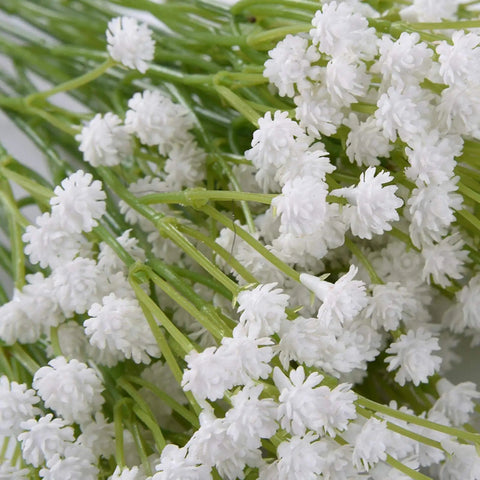 Bundle of delicate white faux flowers with green stems, ideal for decorative arrangements.
