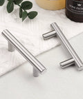Close-up of two brushed nickel T bar cabinet pulls, stainless steel, 5 pack, 4 inch total length, kitchen handles, and M4 screws