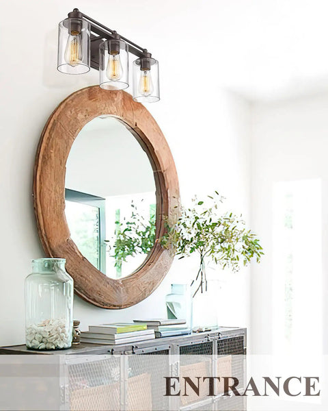 Industrial 3 Light Vanity Light Fixture For Bathroom Over Mirror In Oil Rubbed Bronze Finish Dope Farmhouse Style Wall Sconce Lighting With Rectangular Backplate And Upward Or Downward Mount installed above round mirror on white wall entrance