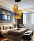 Lantern Style LED Pendant Light With Adjustable Cord Bamboo Weave Ceiling Hanging Lamp in modern rustic bedroom setting