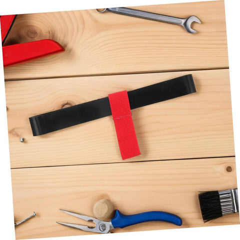 Red Scuba Tank Holder Strap Oxygen Cylinder Carrier for Diving and Snorkeling on a workbench with tools.