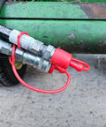 Dust caps for 1/2-inch flat-face hydraulic quick-connects; red rubber covers on metal male/female fittings