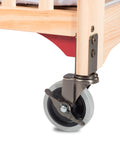 Corner of crib with 4 inch non-marking caster and red gusset plate from Evacuation Hardware Kit For Serenity Cribs Convert To Evacuation Crib With Metal 3 Point Gusset Plate Design Includes 4 Red Gusset Plates And 4 Inch Non Marking Casters Built For Quick No Fuss Moves In Daycare And Childcare