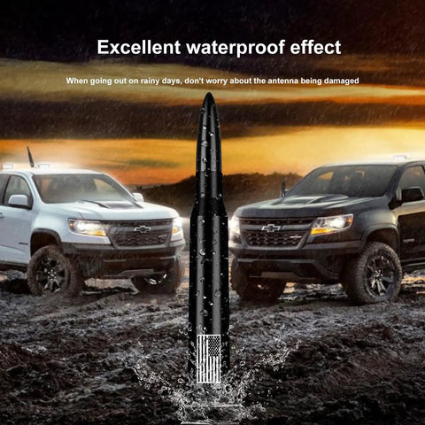 50 Cal Bullet Antenna With American Flag Finish in wet terrain with two Ford trucks