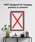Interior with framed picture marked with red X, indicating "NOT designed for hanging posters."