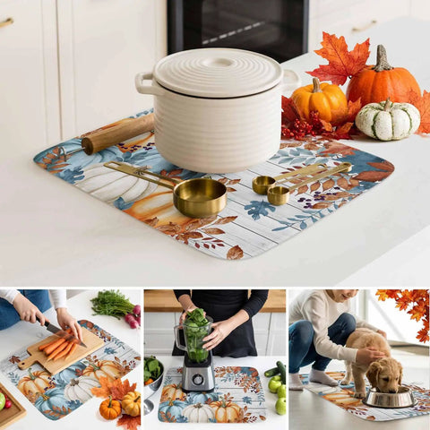 Fall Thanksgiving Dish Drying Mat Set 2 Pack with Pumpkin and Autumn Leaves Wood Grain Design under kitchen items on countertop.