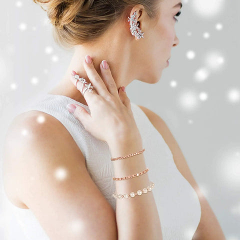 Woman wearing jewelry made from Assorted Spacer Beads Kit With 3000 Pieces Including 1500 4 Mm Faceted Rondelle Cube Beads, 900 4 Mm Round Beads And 600 4 Mm Square Beads In Gold, Silver And Rose Gold For DIY Jewelry Making