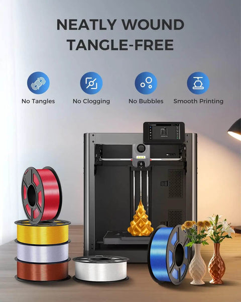3D printer with Silk PLA Filament 1.75mm Silver 1.1Kg Spool with metal shine and smooth silk finish, assorted filament colors displayed.