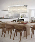 Modern Raindrop K9 Crystal Rectangle Showstopper Chandelier with 11-Light Linear Pendant over dining room table