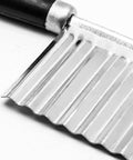 Close-up of Litoexpe crinkle cutter with stainless steel blade and black handle, wavy edge
