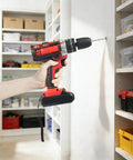 Cordless Drill Set Powerhouse Dual Speed Battery Driver With Three Eighth Inch Keyless Chuck Led Light Tough Nylon Case For Making Short Work Of Wood Tile Plastic Diy Repairs At Home, in use drilling into wall.