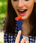 Using the Four Blue Sporks To Go Set With Carrying Case 7 Inch Durable BPA Free 3 In 1 Camping Utensil Kit Spoon Fork And Serrated Knife For Camping Hiking Hunting And Outdoor Adventures to hold a strawberry slice