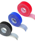 Self Adhesive Cable Management Hoop With Sticky Wire Organizer Keeps Your Desk Slick And Tidy Game Changer Tear Off Nylon Cord Wrap Kit For Home Office In Black. Roll of black, red, and blue nylon cord wraps.
