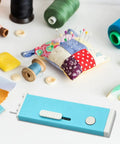 Automatic Needle Threader With Seam Unpicker For Home Sewing Machines Easy Threading Tool For Beginners And Novices No-Fuss Quick Threading Smooth Sewing Sessions Makes Needle Changes Fast And Simple on a blue plastic body
