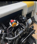 Portable 12V 60W Oil Extractor Pump installed in a boat engine compartment, showing electric oil transfer functionality for fluid changes.