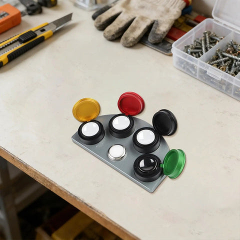 Four Compartment Watch Oil Cup With Color Coded Wells For Quick Lubricant Application on a workbench.