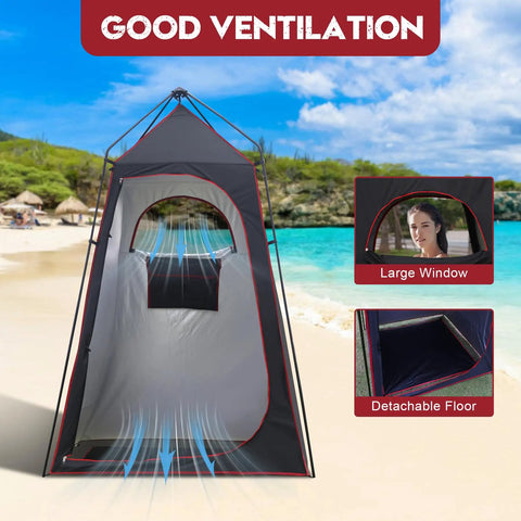 Camping Shower Tent For Privacy On The Go with ventilation window and detachable floor, set up on a beach.