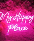 Pink LED Neon Light Sign My Happy Place Two Panel Wall Decor in front of pink roses, bright glow for cozy indoor spaces