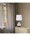 28 Inch Amber Glass Ginger Jar Table Lamp With Dark Bronze Metal Base And Clear Glass Body on bedroom dresser