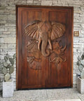 Hand Carved Elephant Doors in African Safari Style Dope Custom Size Interior Barn Door or Exterior Front Door Sliding or Pre Hung Hinged 71x34 Inches No Glass and Hardware Included; detailed exterior view with elephant and wildlife carvings.