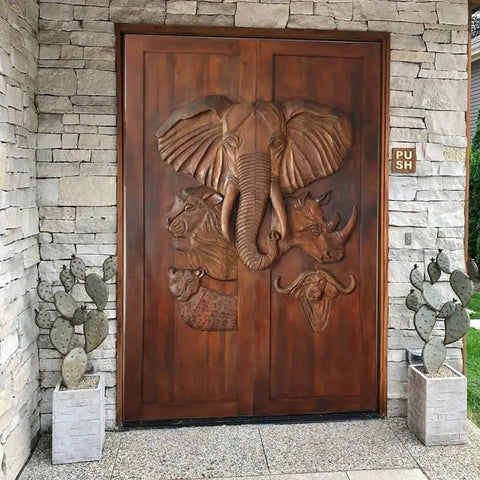 Hand Carved Elephant Doors in African Safari Style Dope Custom Size Interior Barn Door or Exterior Front Door Sliding or Pre Hung Hinged 71x34 Inches No Glass and Hardware Included; detailed exterior view with elephant and wildlife carvings.