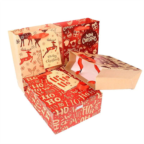 Christmas-themed gift bags with reindeer and 'Ho Ho Ho' patterns, open to display red interiors and handles.