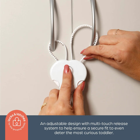 Person demonstrating Flexi Lock Cabinet And Drawer Locks With Multi Touch Release System White 2 Pack No Brainer Kid Proofing
