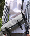 Person carrying Large Capacity Chef Knife Roll Bag With Compartments For Camping Picnics And Hiking Heavy Duty Knife Roll Case