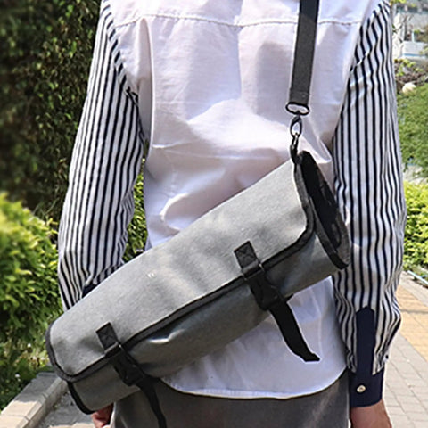 Person carrying Large Capacity Chef Knife Roll Bag With Compartments For Camping Picnics And Hiking Heavy Duty Knife Roll Case