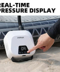 User operating High Pressure Portable Air Pump For Paddle Boards And More Rechargeable Auto Off Dual Stage Inflation And Deflation Quick Fill For SUPs Kites Tents And Mattresses Compact And Easy To Carry
