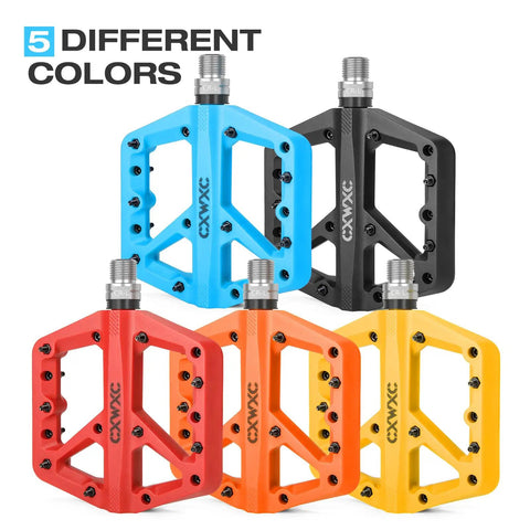 Ultra Lightweight Mountain Bike Pedals With Grippy Traction For Trail And BMX Rides Platform Pedals Nine Sixteenth Inch Axle Nylon Fiber Build Durable And Lightweight Orange shown with color variety