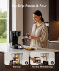 Woman using 12 Cup Drip Coffee Maker With Electric Grinder Combo, Programmable 24 Hour Brew Timer, Auto Shutoff on kitchen counter.