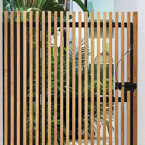 Super Sturdy Stainless Steel Gate Latch Cable Pull Featuring An Adjustable 19 Inch Replacement Line on a wooden fence.