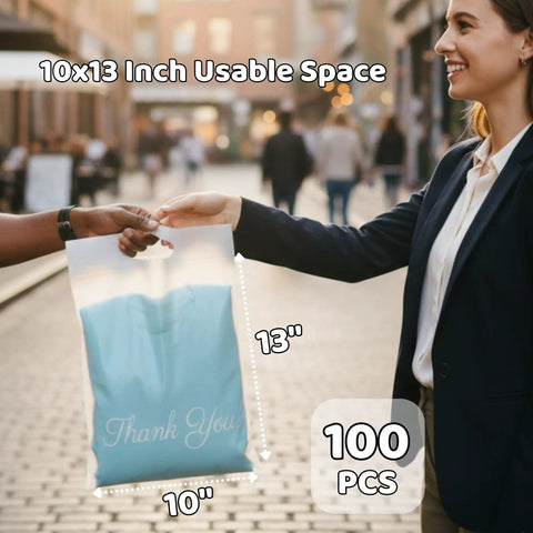 Person holding Frosted 10x13 Poly Mailers 100 Pack With Built In Handle Self Seal Matte Finish Shipping Bags on the street.