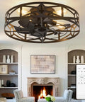Smooth Operator Flush Mount Ceiling Fan with Remote and Six Speeds in Matte Black above a cozy living room with fireplace.