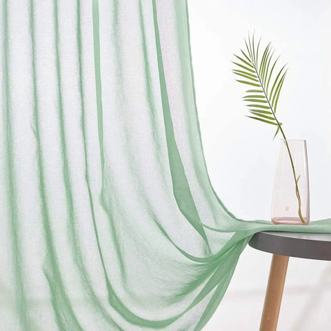 Christmas Green Semi Sheer Curtains With Linen Look draped over a table next to a decorative vase, soft fabric with subtle stripes.