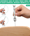 Hand holding pin vise from 57 Piece Micro Drill Bits And Pin Vise Set for Resin Beads Polymer Clay Craft DIY Jewelry and Model Making