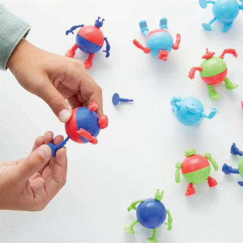 Prize Pod Robot Kit With 52 Piece Vending Machine Build Set And 12 Transforming Capsules, hands assembling capsule robot