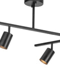 Close-up of two adjustable heads on a six light track lighting with center swivel bar and adjustable heads in matte black finish.
