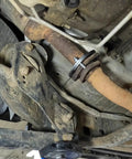 Top Tier Exhaust Flange Repair Kit For Jeep Wrangler JK and JKU 2012 to 2018 installed on exhaust pipe undercarriage.