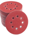 Stack of sanding discs from 210 Piece 5 Inch 8 Hole Sanding Discs Set For Random Orbital Sander Hook And Loop Sandpaper