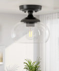Industrial Semi Flush Mount Ceiling Light With Clear Glass Shade And Matte Black Finish in a modern living space.
