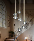 Sleek Modern Crystal Pendant Light With Seven LED Crystals, adjustable brass plating frame, K9 crystal ball chandeliers, in a living room