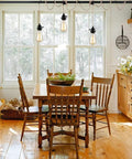 Three Light Hemp Rope Plug In Pendant Light With Woven Rattan Shade And Adjustable Cord Switch For Rustic Farmhouse Decor hanging above a wooden dining table.